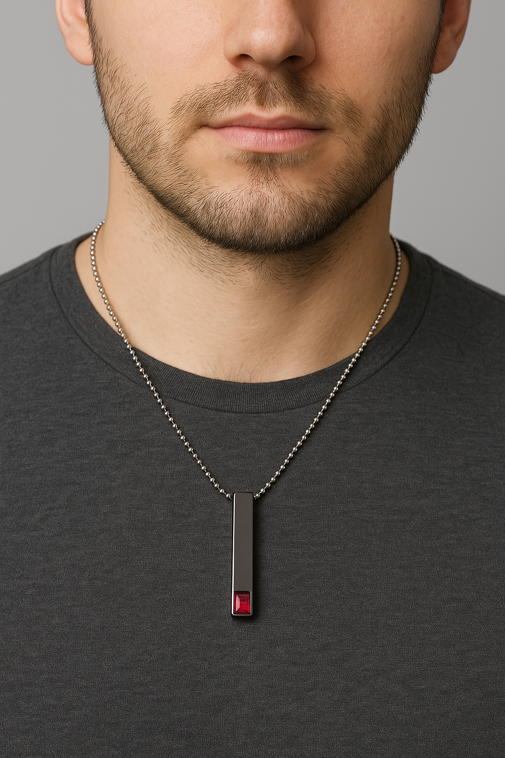 Minimalist men’s black necklace with gemstone worn close-up